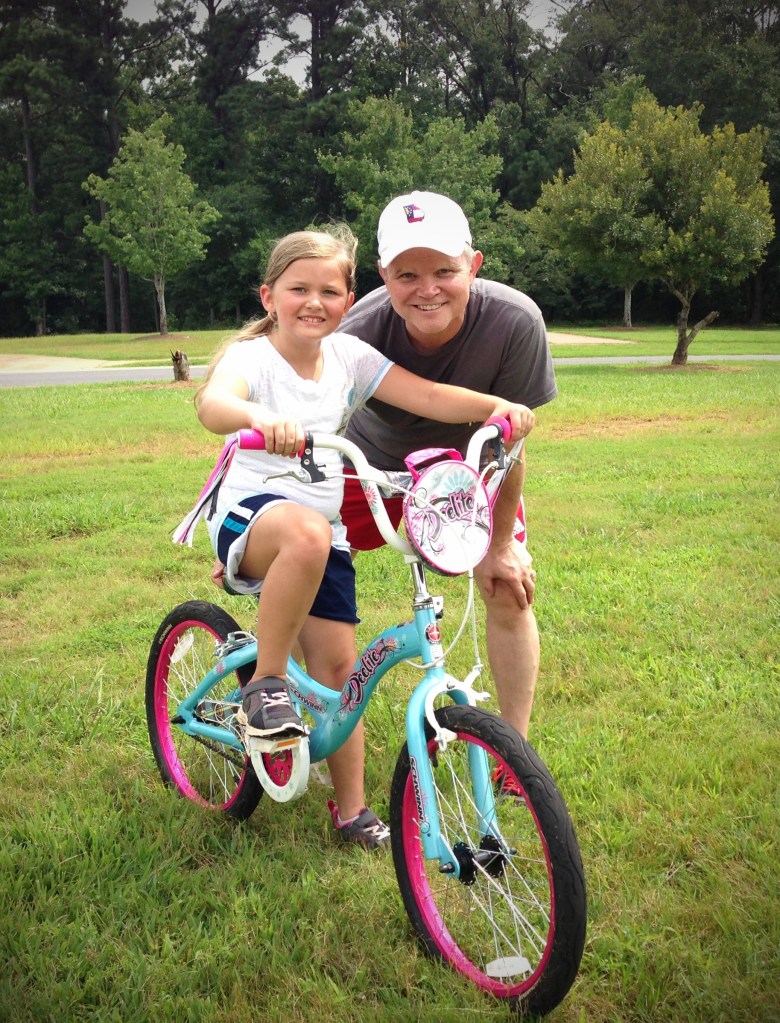 Ella after conquering the bike
